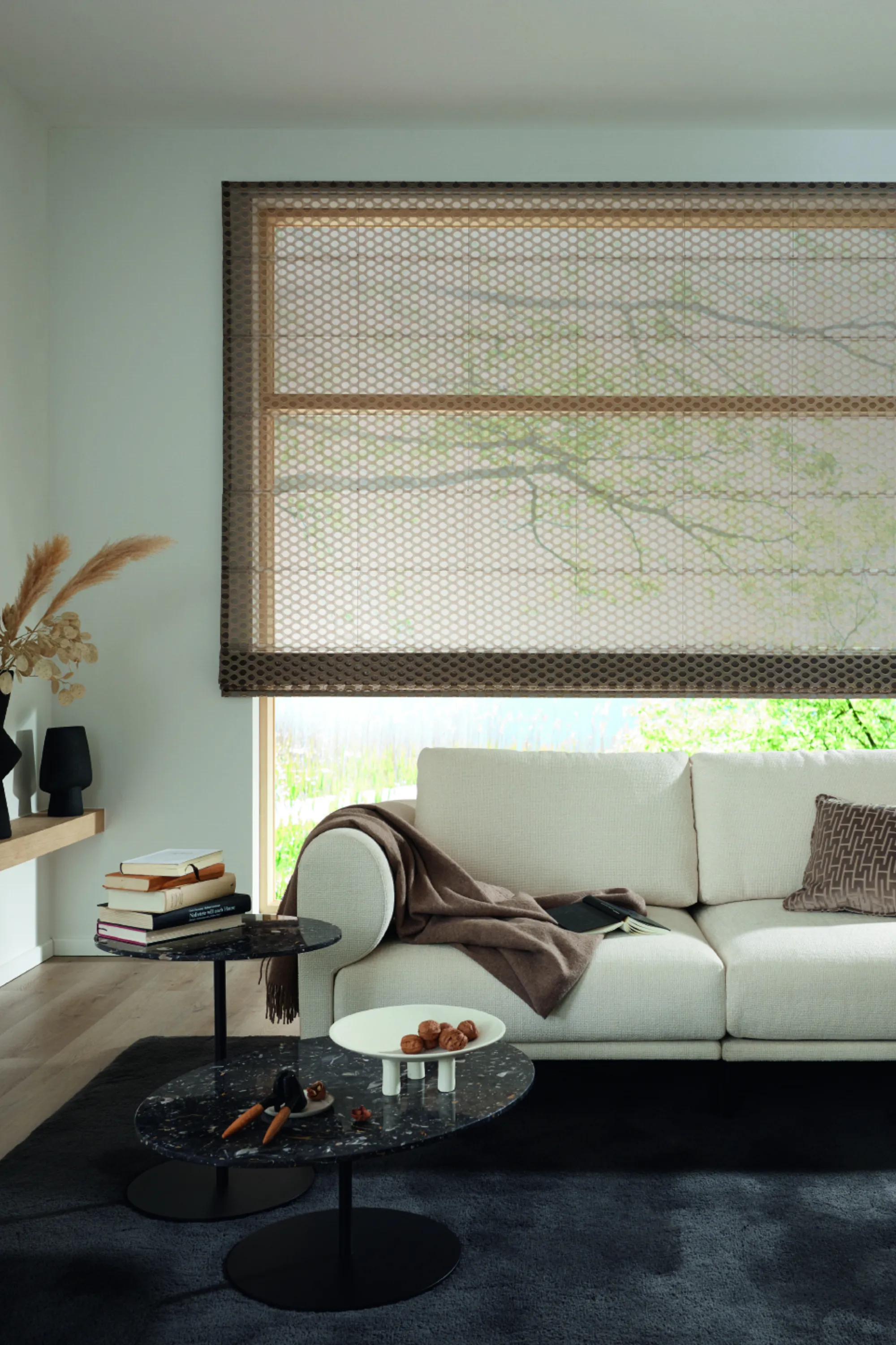 <think> Got it, let's create the alt text. First, look at what's visible. The image shows a modern living room with a white…